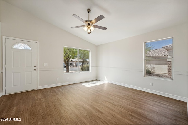 entrance foyer with ceiling fan, lofted ceiling, and dark wood-type flooring