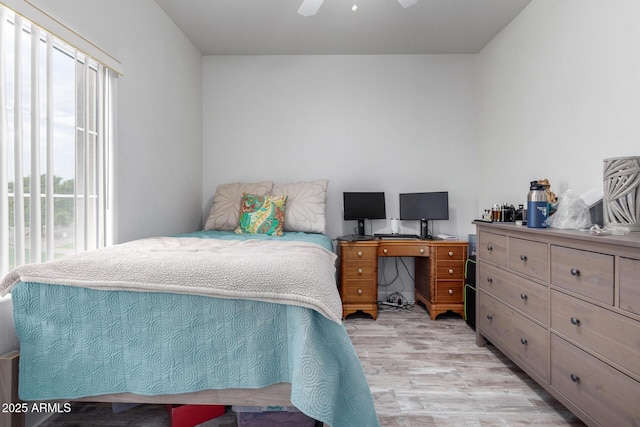 bedroom featuring ceiling fan, access to exterior, and light wood-type flooring