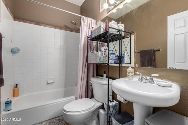 bathroom with shower / bath combination with curtain and toilet