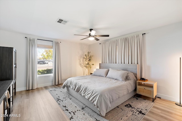 bedroom featuring ceiling fan and light hardwood / wood-style flooring