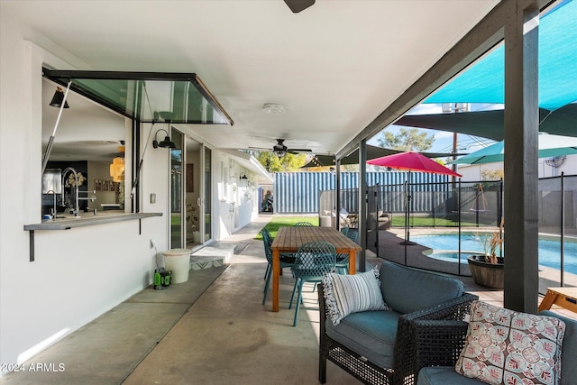 view of patio featuring ceiling fan