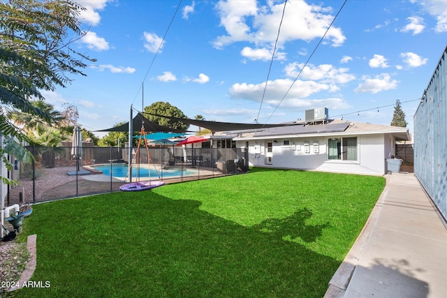 view of yard with a fenced in pool