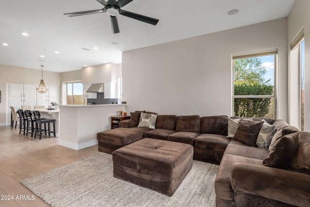 living room featuring ceiling fan, a healthy amount of sunlight, recessed lighting, and light wood finished floors