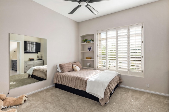 bedroom featuring carpet flooring, ensuite bathroom, baseboards, and ceiling fan