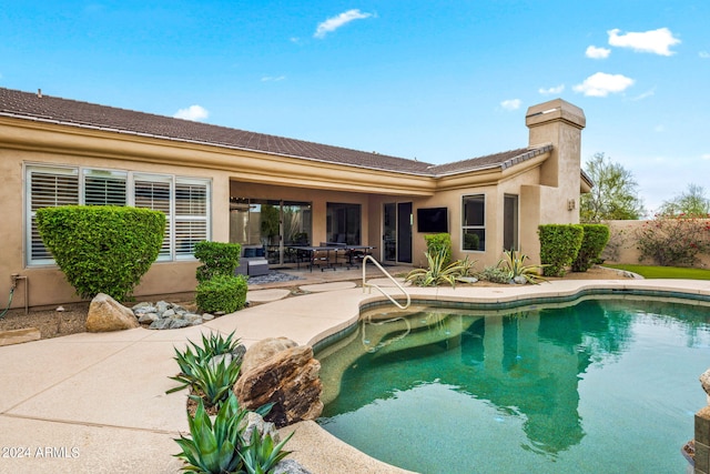 view of pool with a fenced in pool and a patio area