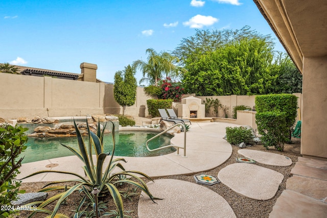 view of swimming pool featuring a fenced backyard, a patio area, and a fenced in pool