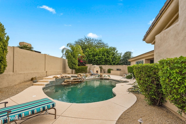 view of pool with a fenced in pool, a fenced backyard, and a patio area