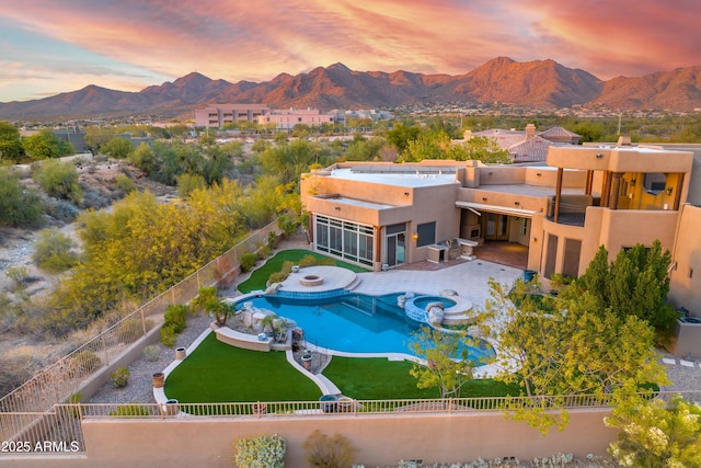 exterior space featuring a mountain view and a sunroom