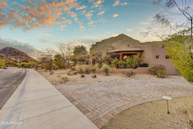 view of front facade featuring a mountain view