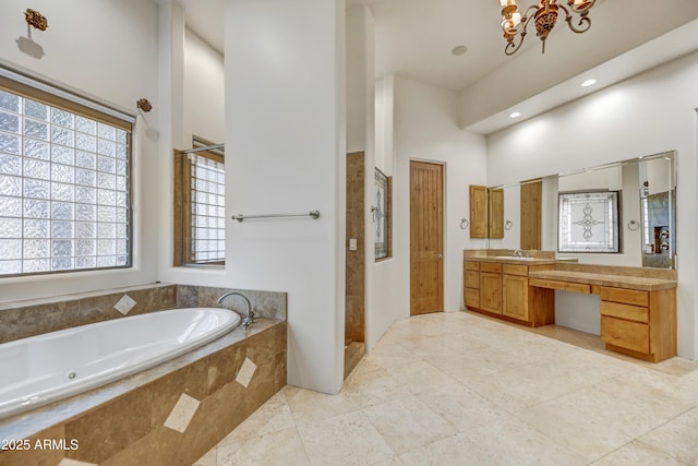 bathroom with vanity, shower with separate bathtub, and a high ceiling