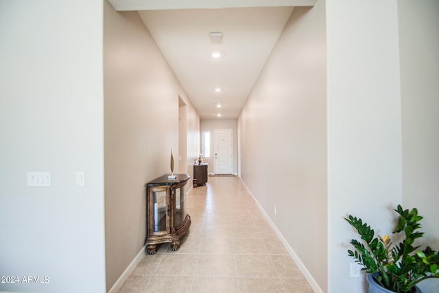 hallway featuring light tile patterned floors