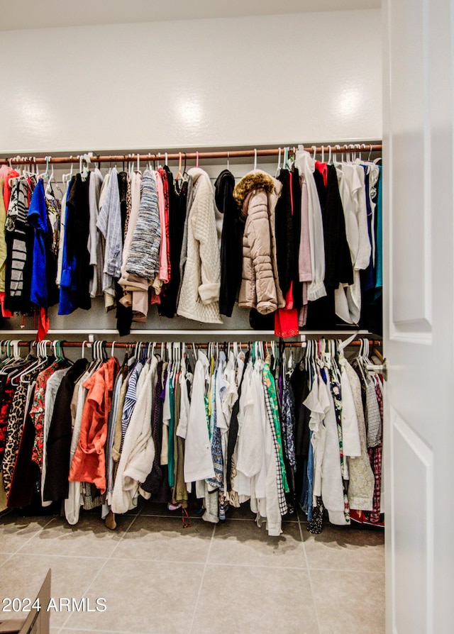 spacious closet featuring tile patterned flooring