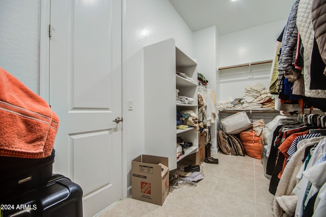 spacious closet featuring light tile patterned floors