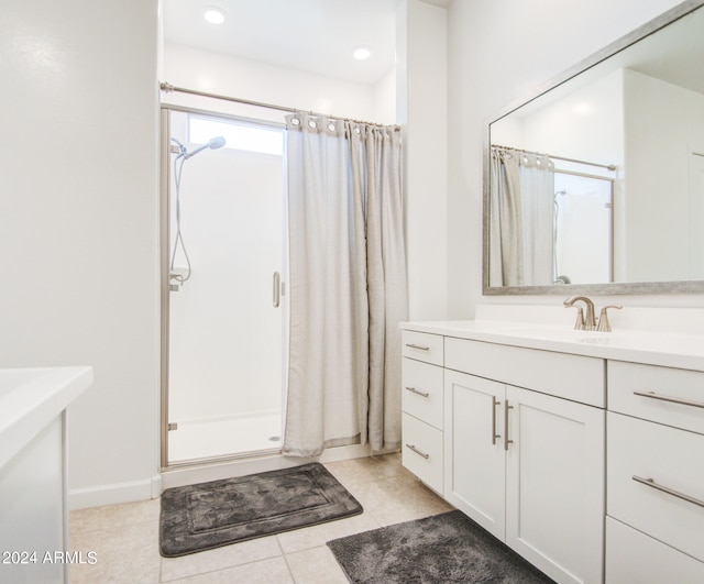 bathroom featuring vanity, a shower with curtain, and tile patterned flooring