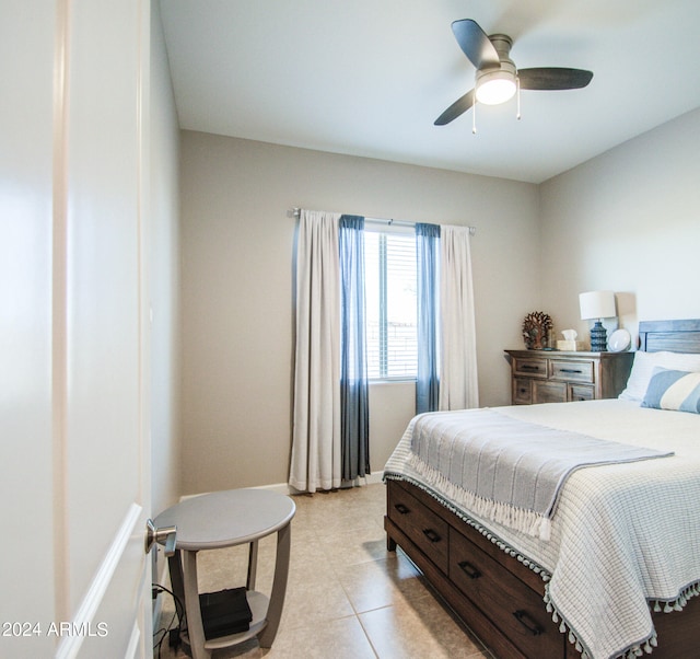 bedroom with light tile patterned floors and ceiling fan