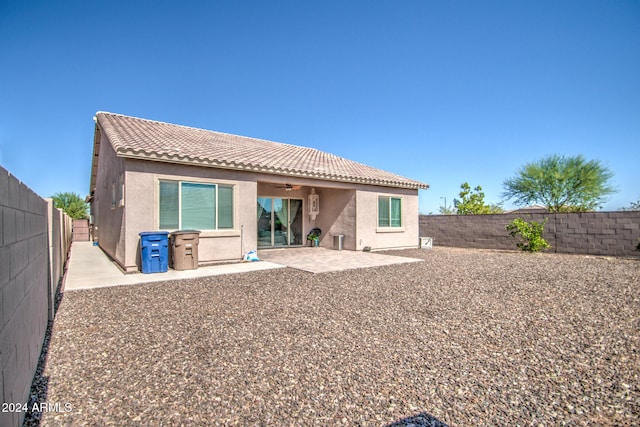 back of property featuring a patio