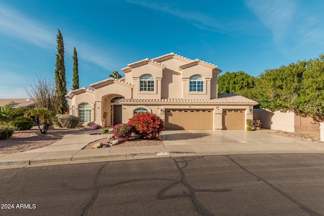 mediterranean / spanish-style house featuring a garage