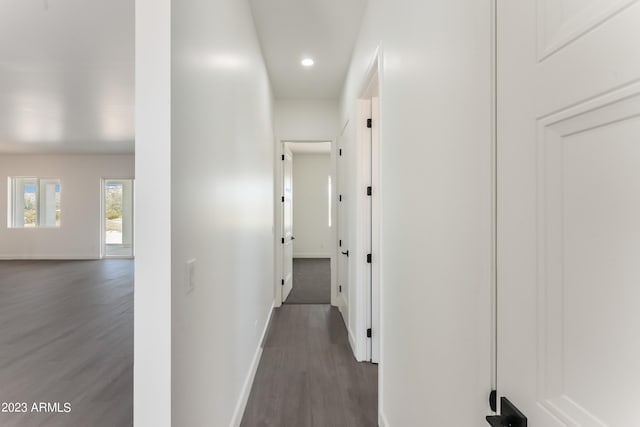 hall with baseboards, recessed lighting, and wood finished floors