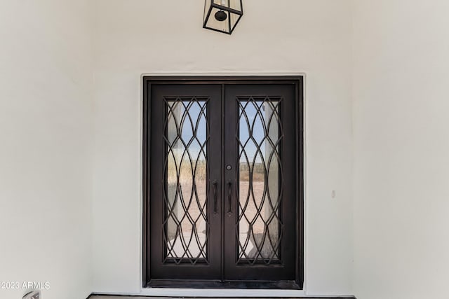 doorway to property with french doors and stucco siding