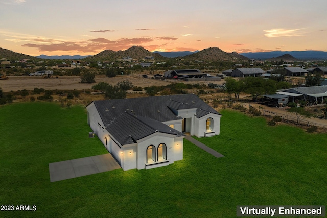 aerial view at dusk with a mountain view