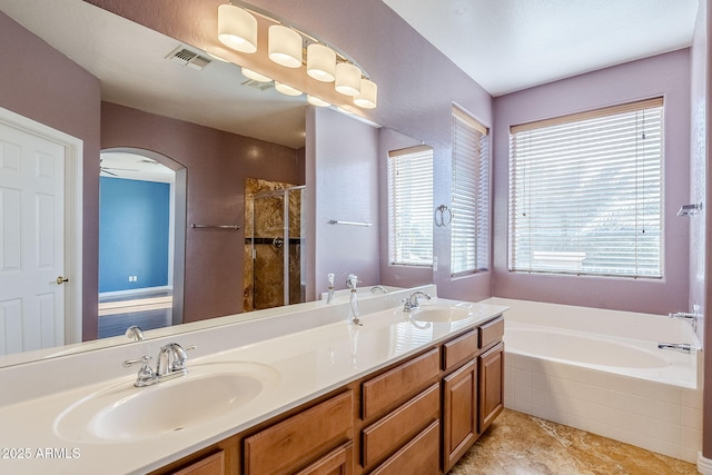 bathroom with vanity and plus walk in shower