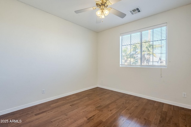 spare room with ceiling fan and hardwood / wood-style flooring