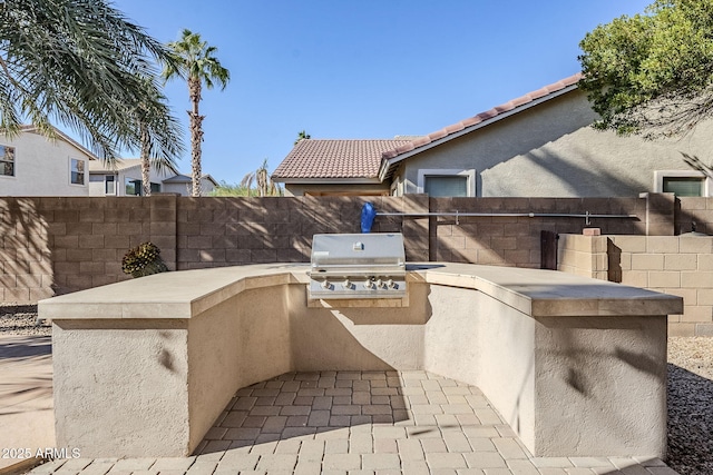 view of patio with a grill and area for grilling