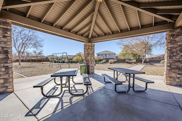 view of patio with a gazebo and a playground