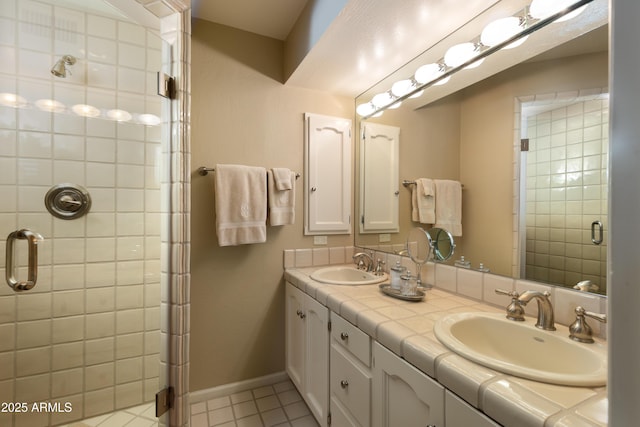 bathroom with vanity, tile patterned floors, and walk in shower