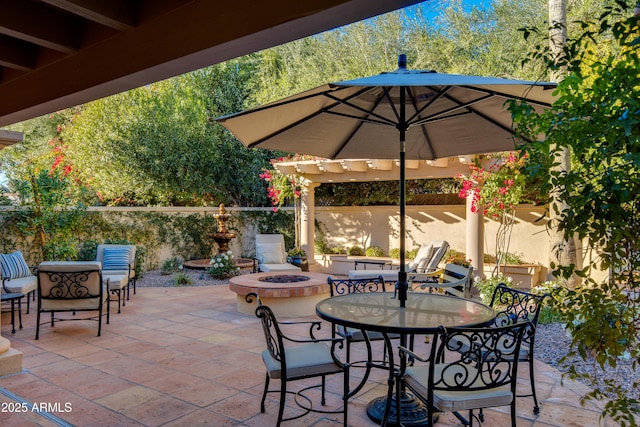 view of patio / terrace with a fire pit