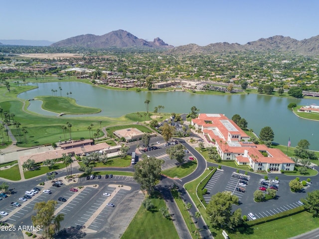 drone / aerial view featuring a water and mountain view