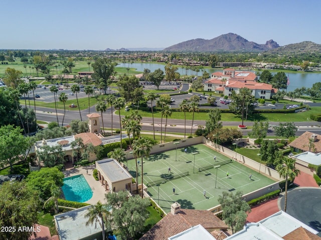 drone / aerial view featuring a water and mountain view