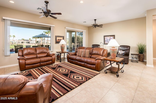 living room featuring light tile patterned floors and ceiling fan