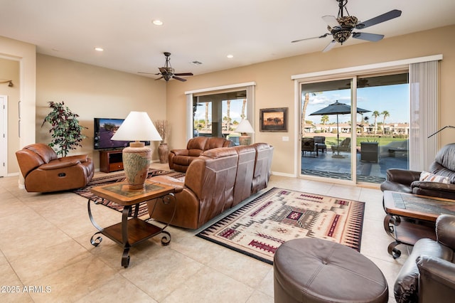 tiled living room featuring ceiling fan