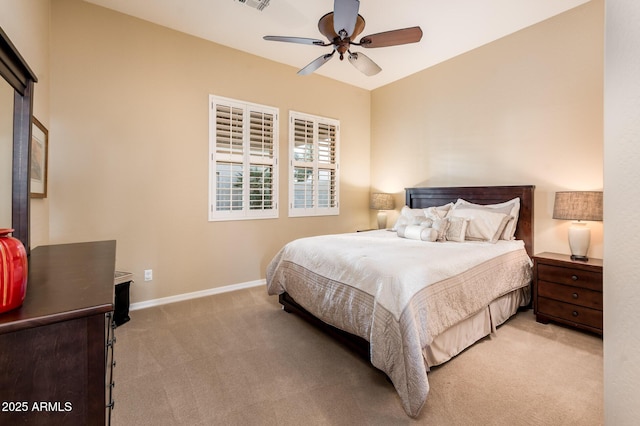 bedroom featuring light colored carpet and ceiling fan