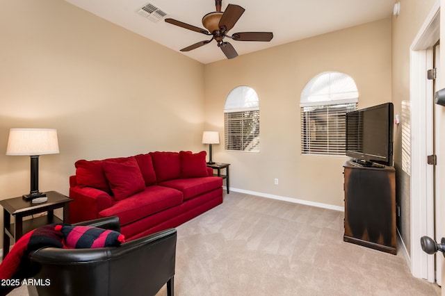 living room featuring ceiling fan and light colored carpet