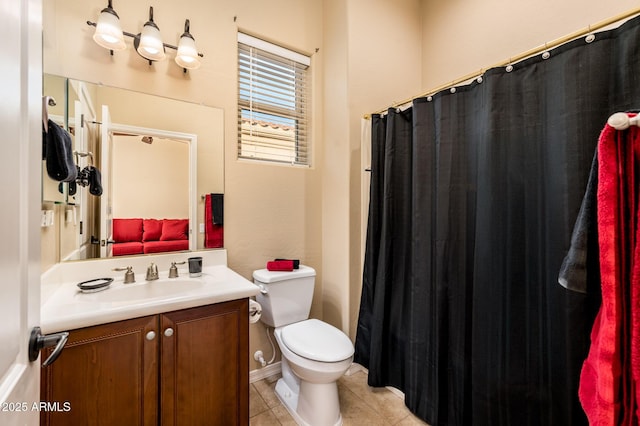 bathroom with vanity, tile patterned floors, and toilet