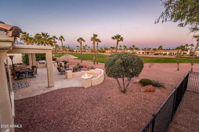 exterior space with a patio and an outdoor fire pit