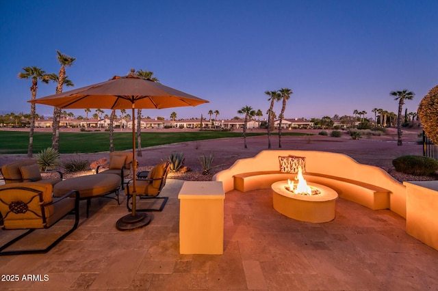 patio terrace at dusk with an outdoor fire pit