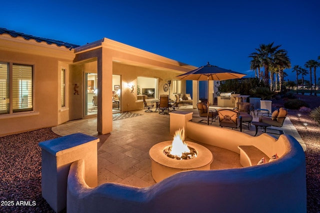 view of patio featuring a fire pit