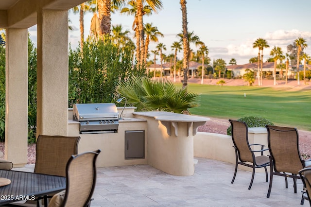 view of patio featuring grilling area and exterior kitchen