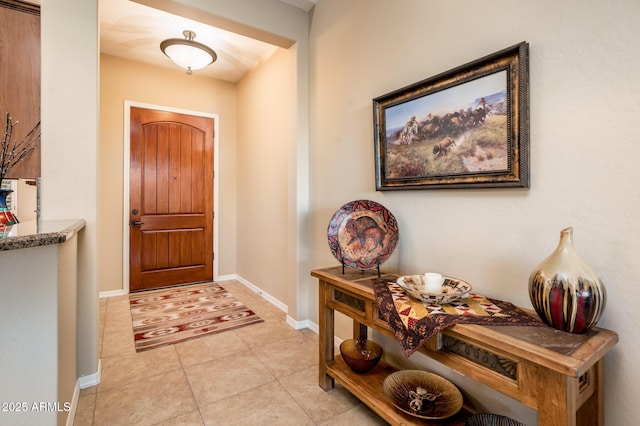 entryway featuring light tile patterned floors