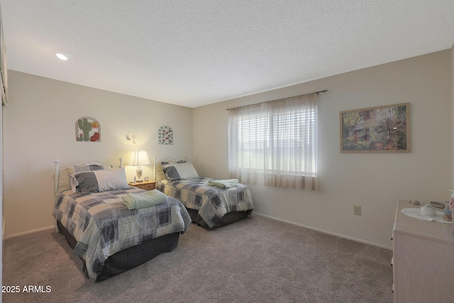 bedroom with carpet flooring and a textured ceiling