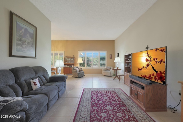 tiled living room with a textured ceiling