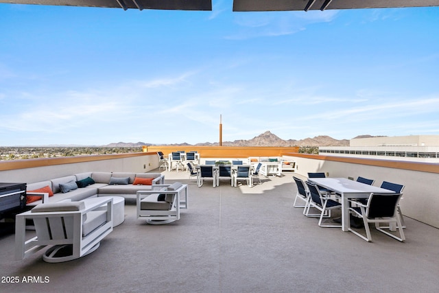 view of patio / terrace featuring outdoor dining area, outdoor lounge area, and a mountain view