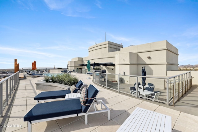 view of patio / terrace with a balcony