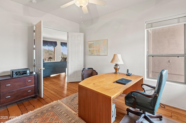 office area with ceiling fan and light hardwood / wood-style flooring