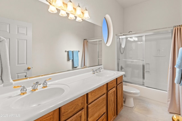 full bathroom featuring tile patterned flooring, vanity, toilet, and enclosed tub / shower combo