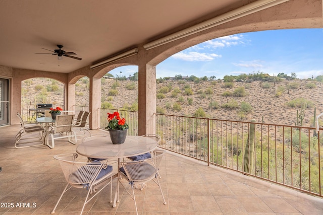 view of patio featuring ceiling fan