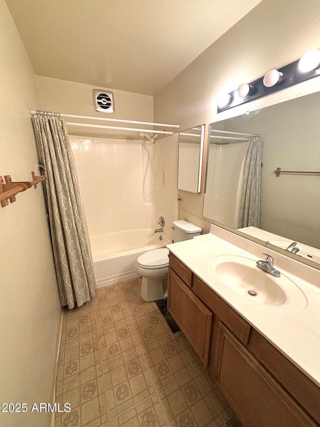 bathroom with visible vents, vanity, shower / bath combo with shower curtain, and toilet